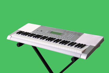 Modern synthesizer on green background