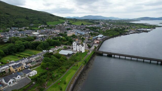 Aerial dolly forward drone shot of Caherciveen from Valentia River, Ireland