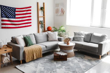 Interior of stylish living room with hanging USA flag