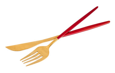 Golden fork and knife with red handles on white background