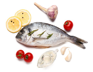 Raw dorado fish with lemon and vegetables on white background