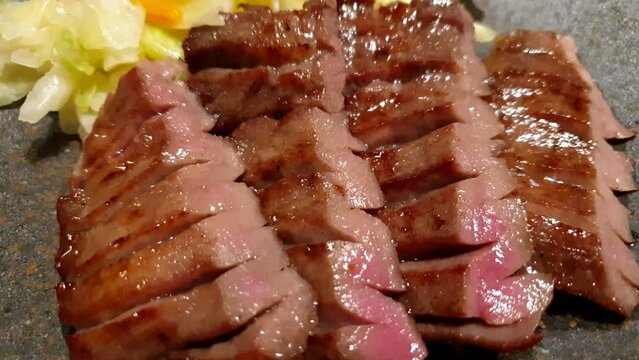 Gyutan beef ox tongue grill of Sendai Japan famous food charcoal grill tender unique texture