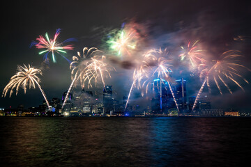 Detroit, Michigan Ford firewroks taken from Windsor, Ontario on the Detroit river with the downtown skyline visibile behind the fireworks