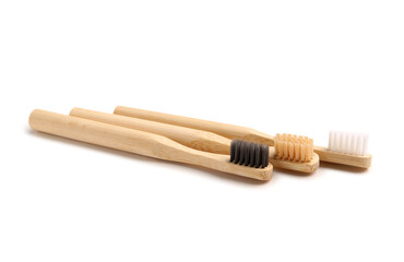 Bamboo tooth brushes on white background