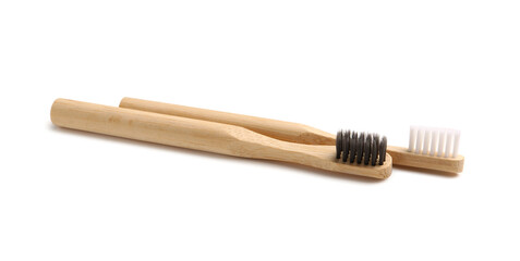 Bamboo tooth brushes on white background