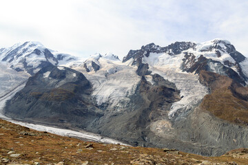 Panorama view with mountain summit Lyskamm (left) and Breithorn (right) in mountain massif Monte Rosa in Pennine Alps, Switzerland