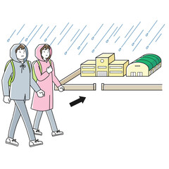 水害に備えて避難場所へ向かう人々