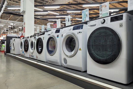 PENANG, MALAYSIA - 24 JUNE 2023: Various brands of washing machine in department at HomePro interior. HomePro is a hypermarket of home product and building construction in Malaysia.