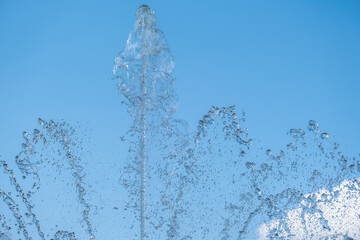 Obraz na płótnie Canvas Transparent water jets in the fountain.