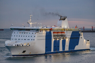 Passenger pax cargo car roro ro-ro ferry boat vessel cruiseship cruise ship liner at sea with sky...