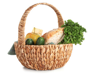 Wicker basket with delicious food for picnic on white background