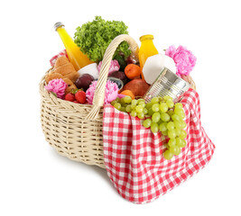 Wicker basket with tasty food for picnic, juice and peony flowers on white background