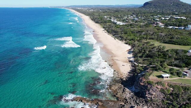 Scenic View From Above Of Yaroomba Beach Near Point Arkwright Lookout In Sunshine Coast, Queensland. aerial pullback