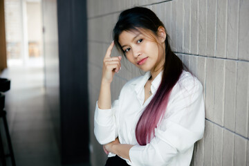 Closeup photo of Asian women thinking and looking upwards at office