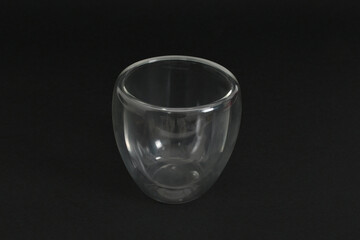 double walled glass on black background.