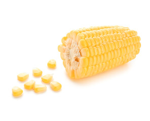 Cut fresh corn cob and seeds on white background