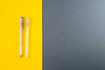 Yellow and gray gel pens.