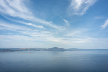 Views of the sea, the cloudy sky and the mountains in the background from Finisterre, the end of...