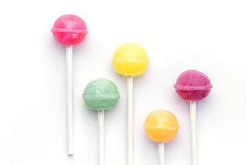 Sweet lollipops on white background