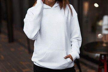 young girl wears white hoodie. white hoodie mock-up