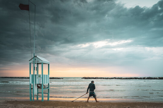 Worker on the beach in Emilia Romagna, Bellaria Igea Marina