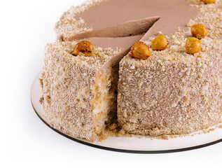 Kiev cake with hazelnut on white plate top view