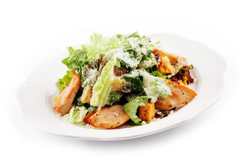 Traditional classic Caesar salad in white plate