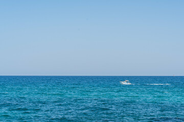 Mediterranean sea and sail of motorboat on spanish seaside