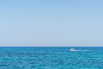 Mediterranean sea and sail of motorboat on spanish seaside