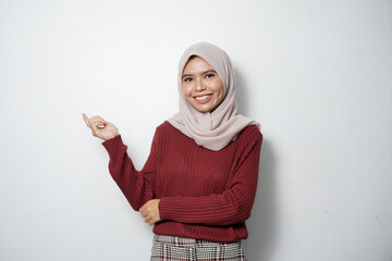 Beautiful young Asian woman in red sweater smiling happy and looking confident isolated over white background