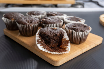 Chocolate muffins on a wooden board. Dessert. food concept. diet