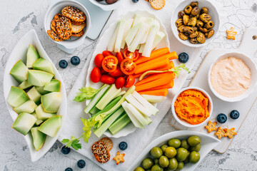 Crudites platter, raw vegetarian food or party vegetarian platter with various veggie snacks and...