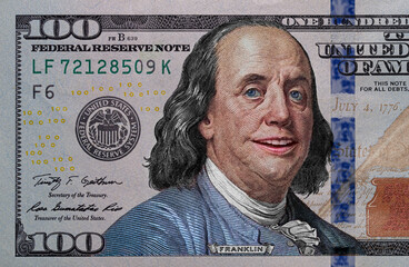 Benjamin Franklin smiling on 100 dollar banknote