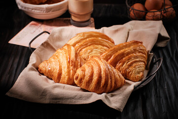 Freshly baked french croissant with dark mood theme,landscape format