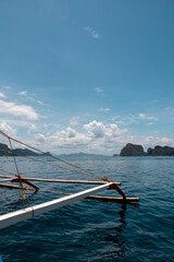 Amazing views from a boat trip in the rocky islands and cliffs in El Nido, Palawan, touristic destination in the Philipines. Turquoise crystal clear sea, scenic views.