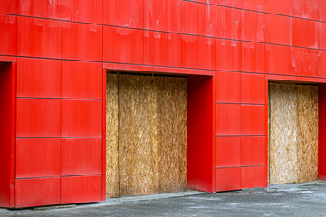 A fragment of the facade of an abandoned building on a summer day