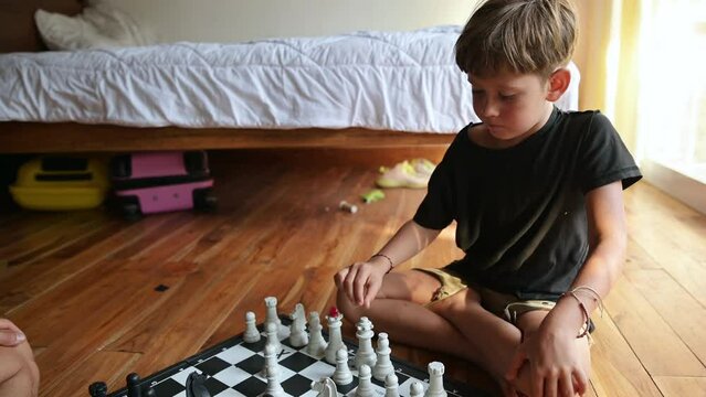 A child playing chess at home