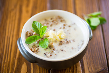 boiled buckwheat with milk and butter for breakfast, in a bowl