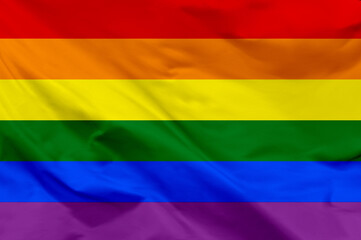 Naklejka premium Waving LGBT flag. LGBT flag close-up.. The gay pride rainbow flag. Rainbow flag