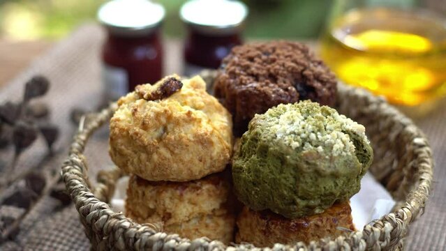 English tea time with delicious scone recipe serve with jam in the garden. Selective focus and free space for text.