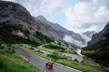 Moto trip. Lifestyle and travel. Beautiful landscape. A road through the Alp mountains.