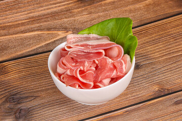 Sliced pork bacon in the bowl