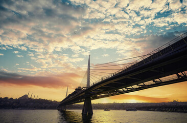 Halic Metro Bridge in Istanbul. Modern cable bridge. Beautiful sunset view on Golden Horn.