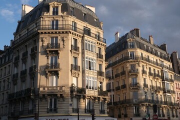 Fototapeta na wymiar Paris building façades, characteristic roofs, and more.It gathers many types of buildings, coming from various districts of the city; all passing through various settings of the day.