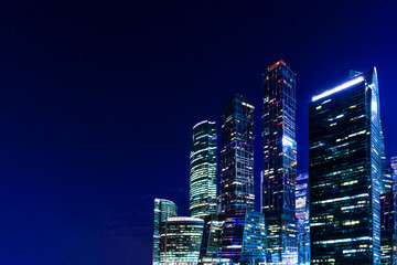 Night business center banner background with Copy space. Night tech office skyscrapers. Business,...