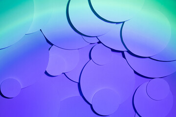 Saturated purple violet turquoise gradient abstract background of soar paper circles pattern, top view, backdrop for advertising, design, card, poster, flyer, text, disco hipster vapor wave style.