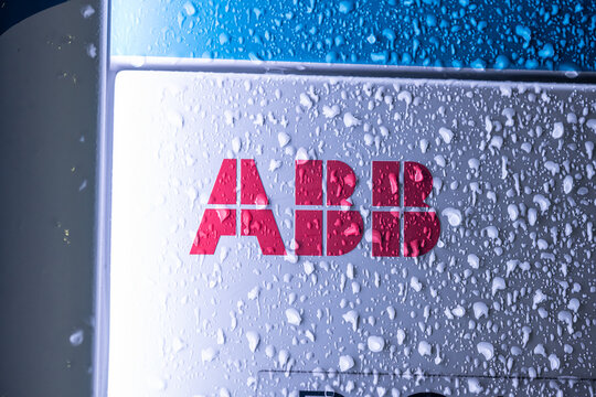 Lillesand, Norway - January 03 2023: Frozen text and branding on a ABB fast electric vehicle charger.