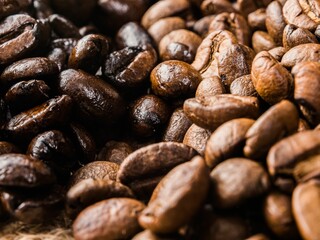 Closeup shot of a pile of fresh roasted coffee beans