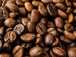 Closeup shot of a pile of fresh roasted coffee beans