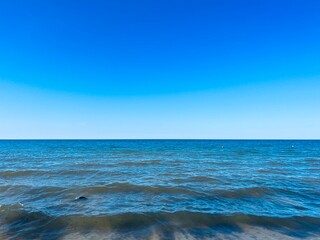 Blue seascape, sea coast, clear blue sky